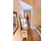 Bright hallway with hardwood floors and a console table at 5169 Oxford Dr, Sarasota, FL 34242