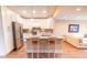 Modern kitchen with white cabinets, stainless steel appliances and breakfast bar at 5169 Oxford Dr, Sarasota, FL 34242