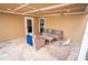 Covered patio with seating area and access to kitchen at 5169 Oxford Dr, Sarasota, FL 34242