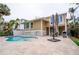 Inviting kidney-shaped pool with expansive patio at 5169 Oxford Dr, Sarasota, FL 34242