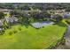 Aerial view of tennis courts and surrounding residential area with lush landscaping at 5171 51St W Ln, Bradenton, FL 34210