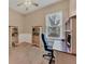 Bedroom with bookshelves and a desk beneath a bright window at 5171 51St W Ln, Bradenton, FL 34210