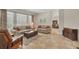 Bright and airy living room featuring neutral decor, tiled floors, and comfortable seating, and natural light at 5171 51St W Ln, Bradenton, FL 34210