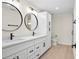 Modern bathroom with double vanity, quartz countertops, and black matte fixtures at 5270 Adina Cir, North Port, FL 34291