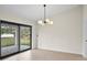 Dining area with sliding glass doors leading to the backyard at 5270 Adina Cir, North Port, FL 34291