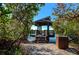 Secluded waterfront dock with gazebo, steps, and benches at 5450 Eagles Point Cir # 301, Sarasota, FL 34231