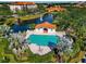 Aerial view of community pool and lake at 5450 Eagles Point Cir # 301, Sarasota, FL 34231