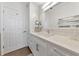 Bathroom with a vanity, quartz countertop, and a large mirror at 5450 Eagles Point Cir # 301, Sarasota, FL 34231