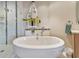 Relaxing bathroom with a large free-standing tub and walk-in shower at 5450 Eagles Point Cir # 301, Sarasota, FL 34231