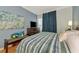 Bright bedroom with a king-size bed and stylish decor at 5450 Eagles Point Cir # 301, Sarasota, FL 34231