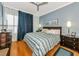 Spacious bedroom with wood floors and a king-size bed at 5450 Eagles Point Cir # 301, Sarasota, FL 34231