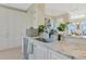 Modern kitchen with granite countertops and stainless steel appliances at 5450 Eagles Point Cir # 301, Sarasota, FL 34231