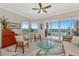 Bright living room with water views, comfy seating, and a coffee table at 5450 Eagles Point Cir # 301, Sarasota, FL 34231