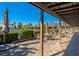 Covered patio with seating and umbrellas at 5450 Eagles Point Cir # 301, Sarasota, FL 34231