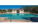 Community pool with adjacent cabana at 5450 Eagles Point Cir # 301, Sarasota, FL 34231