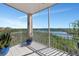 Relaxing screened balcony overlooking the water with lush greenery at 5450 Eagles Point Cir # 301, Sarasota, FL 34231