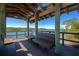 Scenic waterfront gazebo with wooden benches, offering peaceful views at 5450 Eagles Point Cir # 301, Sarasota, FL 34231