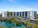 Condo building with pool and lush landscaping at 5855 Midnight Pass Rd # 520, Sarasota, FL 34242