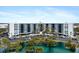 Building with waterfront views and lush landscaping at 5855 Midnight Pass Rd # 520, Sarasota, FL 34242