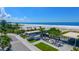 Aerial view of Siesta Key beach, featuring beachside buildings and palm trees at 5855 Midnight Pass Rd # 520, Sarasota, FL 34242