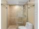 Clean bathroom with a tiled shower and toilet at 5855 Midnight Pass Rd # 520, Sarasota, FL 34242