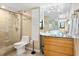 Modern bathroom with glass shower, vessel sink, and granite countertop at 5855 Midnight Pass Rd # 520, Sarasota, FL 34242