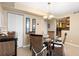 Bright dining area with a glass-top table and wicker chairs at 5855 Midnight Pass Rd # 520, Sarasota, FL 34242