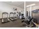 Fitness center featuring treadmills, elliptical machines, and weight equipment at 5855 Midnight Pass Rd # 520, Sarasota, FL 34242