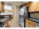 Kitchen features stainless steel appliances and granite countertops at 5855 Midnight Pass Rd # 520, Sarasota, FL 34242