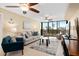 Bright living room with water views and comfy furniture at 5855 Midnight Pass Rd # 520, Sarasota, FL 34242