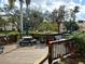 Relaxing community deck with tables and seating area at 625 30Th W Ave # G409, Bradenton, FL 34205