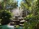 Serene water fountain in lush landscaping at 625 30Th W Ave # G409, Bradenton, FL 34205