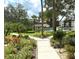 Landscaped walkway leading to community amenities at 625 30Th W Ave # G409, Bradenton, FL 34205