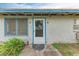 White front door with blue trim and screen door at 6307 30Th E Ave, Palmetto, FL 34221