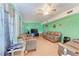 Cozy living room with leather sofas, TV, and ceiling fan at 6307 30Th E Ave, Palmetto, FL 34221