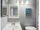 Bathroom with a vanity, toilet and a framed mirror at 712 Bird Bay Dr # 146, Venice, FL 34285