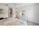 Comfortable bedroom with dresser and access to the bathroom at 712 Bird Bay Dr # 146, Venice, FL 34285