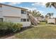 Condo unit entrance with stairs and landscaping at 712 Bird Bay Dr # 146, Venice, FL 34285