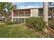 Condo building exterior, showcasing the landscaping at 712 Bird Bay Dr # 146, Venice, FL 34285