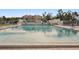 Community swimming pool with lounge chairs at 712 Bird Bay Dr # 146, Venice, FL 34285