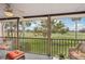 Relaxing screened balcony overlooking a lush green golf course at 712 Bird Bay Dr # 146, Venice, FL 34285