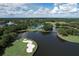 Aerial view of golf course and clubhouse at 7220 Kensington Ct, University Park, FL 34201