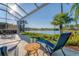 Relaxing screened patio overlooking a lake at 7220 Kensington Ct, University Park, FL 34201