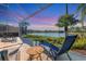 Enjoy sunset views from your screened lanai with lake access at 7220 Kensington Ct, University Park, FL 34201