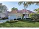 Single-story home with attached garage and well-manicured lawn at 7220 Kensington Ct, University Park, FL 34201