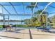 Screened lanai overlooking a peaceful lake at 7220 Kensington Ct, University Park, FL 34201