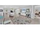 Spacious living area with a view of the kitchen and access to a bedroom at 7220 Kensington Ct, University Park, FL 34201