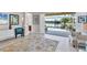 Open living space with patio doors leading to a view of the water at 7220 Kensington Ct, University Park, FL 34201