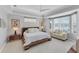 Spacious main bedroom with sitting area and water views at 7220 Kensington Ct, University Park, FL 34201