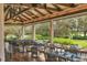 Outdoor dining area with lake views at 7220 Kensington Ct, University Park, FL 34201